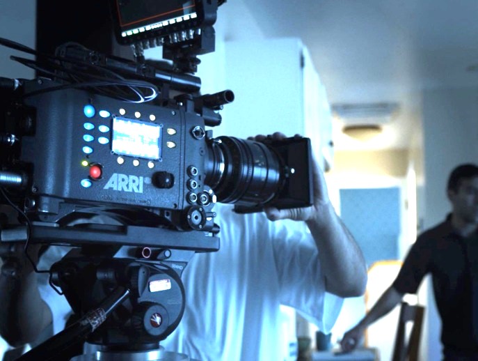 Employee holding a camera